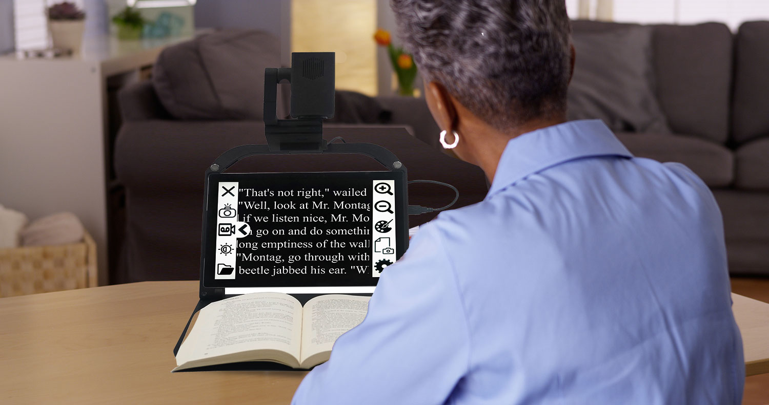 Senior woman using ONYX PRO to read a book